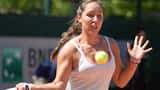 Jessica Pegula in action at a 2026 WTA tournament, preparing to serve on hard court