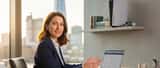 British consumer rights solicitor reviewing PS5 price increase documentation at London office desk