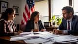 Immigration lawyer consulting with couple reviewing visa documents and legal files in US law office
