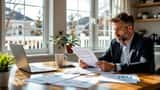 Canadian taxpayer reviewing CRA audit documents at kitchen table