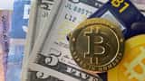 Bitcoin and Canadian dollar bills on a table — cryptocurrency tax planning