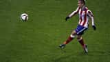 Antoine Griezmann i Atlético Madrid-drakt i aksjon på fotballbanen, Champions League