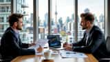 Financial advisor reviewing investment charts with a young professional athlete in an office