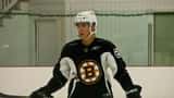 Boston Bruins player at NHL training camp during contract negotiation season 2026
