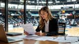 Female basketball player reviewing sports contract with lawyer at desk