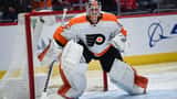 Philadelphia Flyers player on ice during NHL playoff game at arena