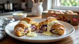 Döner Croissant mit Hähnchenfleisch, Kraut und weißer Soße auf Teller, Lidl-Packung im Hintergrund