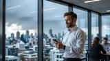 Australian office worker checking weather app during severe storm warnings in Sydney CBD