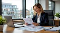 HR professional reviewing pension auto-enrolment payroll documents at a desk in a Leeds corporate office