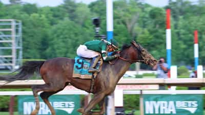 Golden Tempo at the 2026 Belmont Stakes finish line, racing to victory