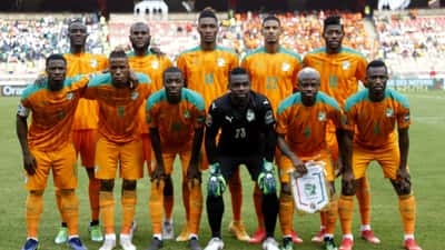 Ivory Coast national football team players in orange kit