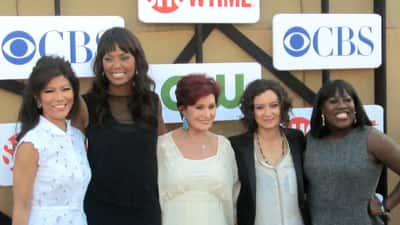 Sharon Osbourne at a public event in 2012, surrounded by other television personalities