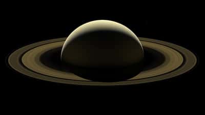 Hubble Space Telescope image of Saturn with its rings backlit against the darkness of space