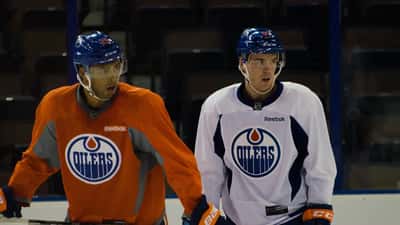 Connor McDavid and Darnell Nurse playing for the Edmonton Oilers