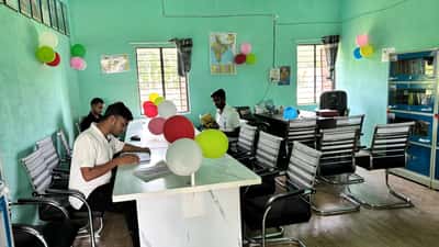 Students reading books in a public library