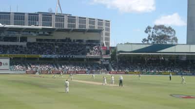 Australia bowler in delivery stride against South Africa during a Test match