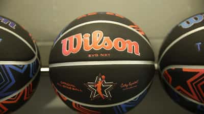 WNBA player shooting during the 2026 All Star three-point contest in a live arena