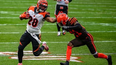 Joe Mixon running back in action on NFL field carrying the ball during game