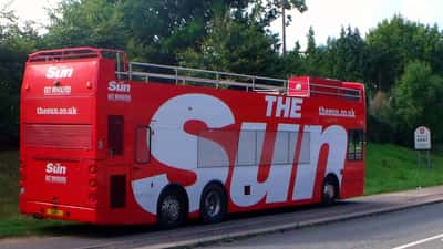 A London bus branded with The Sun newspaper logo representing the UK tabloid data rights controversy in 2026