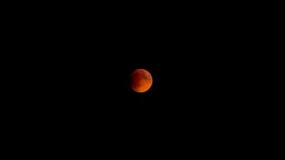 Blood-red moon photographed during total lunar eclipse over Sacandaga, New York