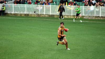 Aussie rules football player in action during an AFL match