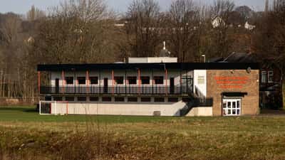 Manchester United Academy training ground in Carrington, showing youth football pitches and facility buildings