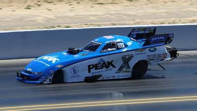 John Force at Sonoma Raceway 2023, drag racing legend in his Funny Car team gear