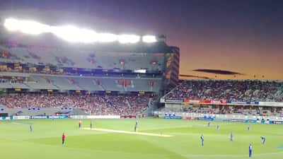 Eden Park Auckland stadium at dusk illuminated for evening match