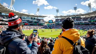 Football fans travelling to New Zealand vs Belgium 2026 consulting a medical expert on a smartphone