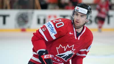 John Tavares in Team Canada hockey action, representing peak athletic performance and career planning