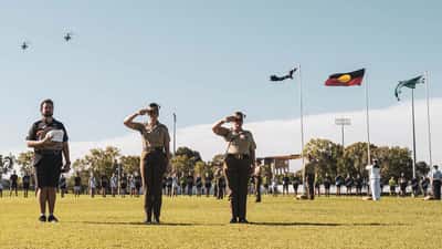 Australian football players in action during an ANZAC Shield AFL match — sports health and injury prevention 2026