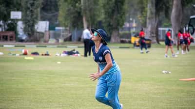 Women cricketers warming up at an ICC Women's T20 World Cup qualifier