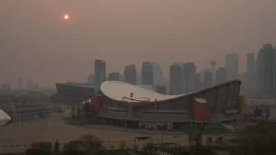 Downtown Calgary skyline blanketed in wildfire smoke during the July 2026 air quality event