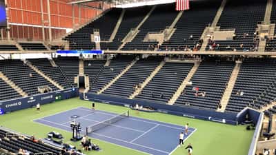 Australian tennis player practising at US Open Armstrong Stadium, outdoor hard court, New York