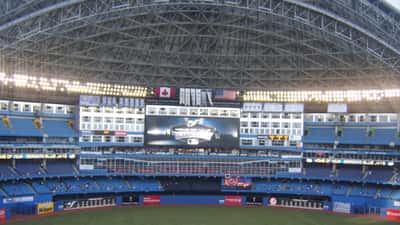 Rogers Centre interior during a Toronto Blue Jays baseball game, packed stands under retractable roof, Toronto Canada