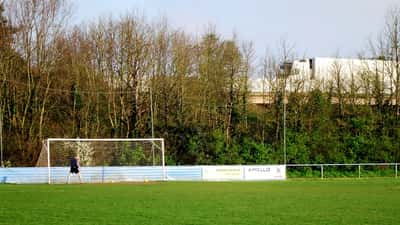Non-league football players in action at a grassroots English football match