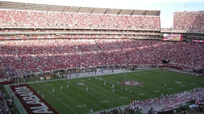 Alabama Crimson Tide football players in game action on the field