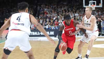 Team Canada basketball player driving to the basket during a FIBA international game