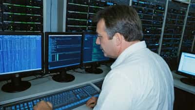 IT security specialist monitoring quantum encryption threats in Australian data centre