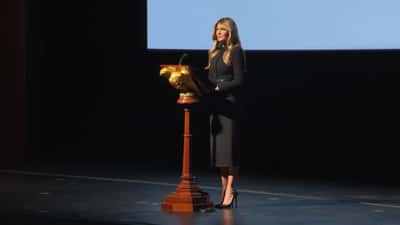 First Lady Melania Trump speaking at a public event promoting foster care investment accounts for children in 2026