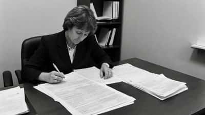 Woman reviewing family law separation documents at a Sydney law office