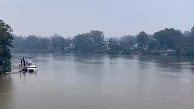 Brisbane River blanketed in orange bushfire smoke haze in Australia