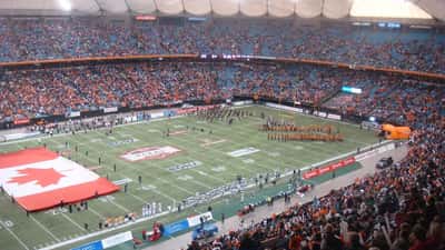 CFL playoff game action, players contesting the ball on the field
