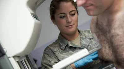 Breast cancer awareness screening event with pink ribbon, mammography clinic setting Australia 2026