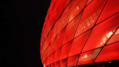 Allianz Arena stadium lit up during a Bundesliga match in Munich Germany