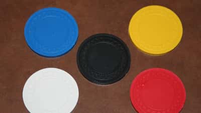 Poker chips on table representing online gambling addiction risk
