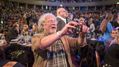 Bill Oddie, British wildlife presenter and mental health advocate, photographed in concentration — a symbol of his legacy for Australian mental health awareness