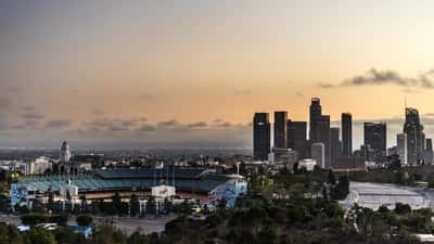 Aerial view of Dodger Stadium with Downtown Los Angeles skyline in the background