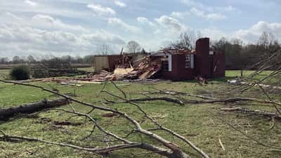 Tornado damage to structures in Mississippi, debris field with destroyed buildings after violent twister