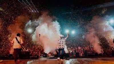 Bruno Mars performing live on stage during concert tour